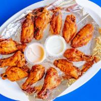 12 Wings · 12 home-made chicken wings, choice of BBQ or spicy Buffalo sauce.
