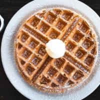 Side Waffle · Belgian waffle topped with cinnamon and powdered sugar.
