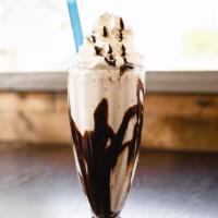 Cookies & Cream Shake · Cookies and cream ice cream and milk topped with whipped cream.