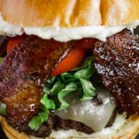 Signature Steakhouse Burger · Beef burger, 3-spice & brown sugar bacon, swiss cheese, roasted garlic aioli, arugula, tomato