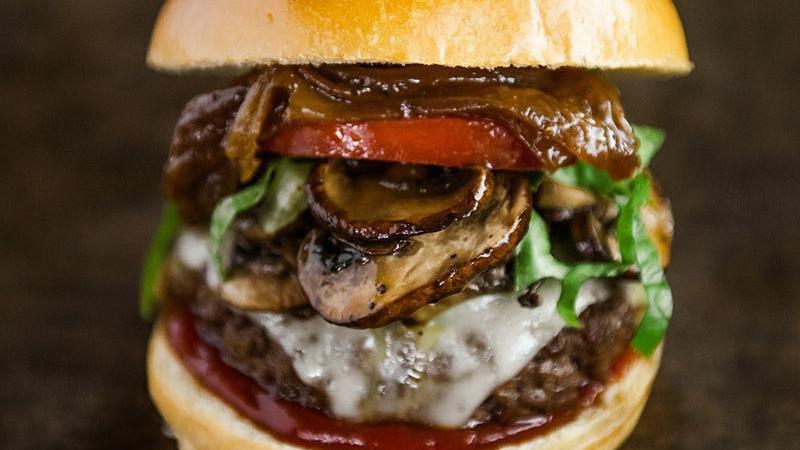 Mushroom Burger · Beef burger, caramelized onions & steakhouse mushrooms, swiss cheese, spicy ketchup, arugula, tomato, brioche bun