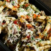 Cheesesteak Fries · Fries topped with Filet Mignon cheesesteak, melted White American Cheese, grana padana chees...