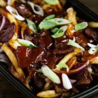 Burnt End Pork Belly Fries · Fries topped with smoked pork belly, burnt end-seasoning, shredded white American cheese, sc...