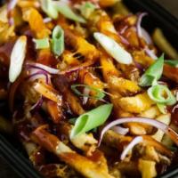 Bbq Fries · Fries topped with shredded white American cheese, scallions, red onion, garlic oil, BBQ glaze