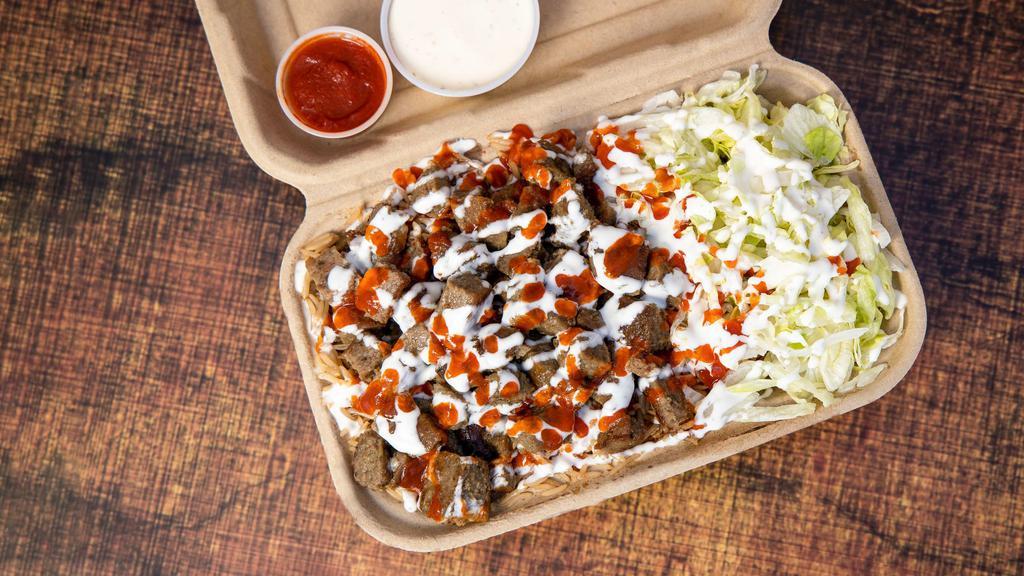 Lamb Over Rice · Comes with rice, lamb, salad, white sauce, hot sauce, any drink and tax included.