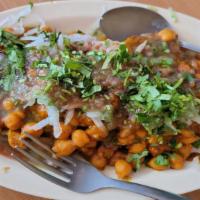 Chaat Special ( Aloo/Samosa/Tikki) · Famous Indian Chaats with garbanzo beans, onions and dressing of yogurt and sauces.
