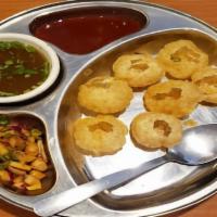 Pani Poori · (6) crispy puffed wafers made from semolina served with spicy mint water and chutneys.
