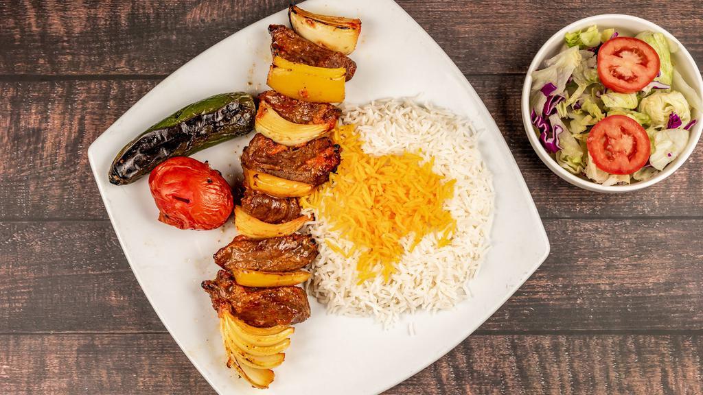 Shish Kabob · Grilled, juicy, large chunks of beef marinated in our special sauce and skewered with onions, tomato, and green peppers. Served with basmati rice and salad.