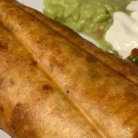 Chimichanga · Deep fried burrito with choice of meat, rice, beans, cheese, and topped with sour cream and ...