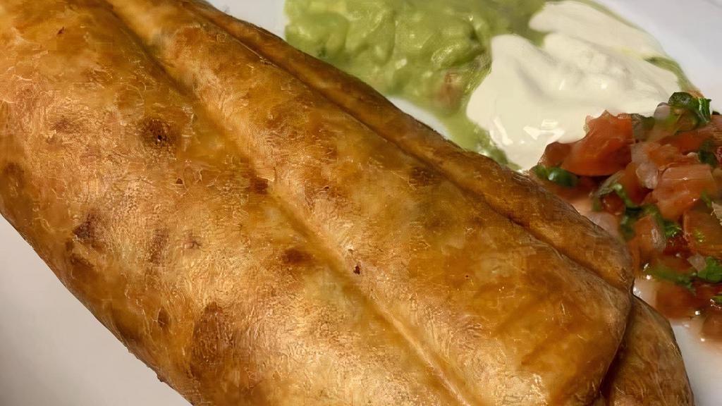 Chimichanga · Deep fried burrito with choice of meat, rice, beans, cheese, and topped with sour cream and guacamole.