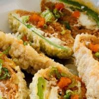 Jalapèno Popper · Fried jalapeno stuffed with cream cheese, and spicy tuna.