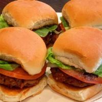 Beyond Beef Sliders · Vegan. Four beyond beef sliders topped with mayo, lettuce and tomato.
