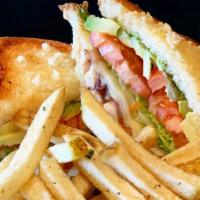 Boogie Melt · Grilled chicken breast, bacon, swiss, avocado, lettuce, tomato on sourdough bread toasted wi...