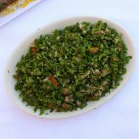 Tabbouleh · Fresh chopped parsley mixed with bulgur wheat, mint, tomatoes, green onions, lemon juice and...