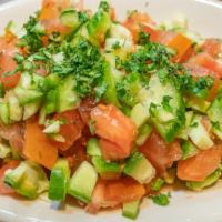Garden Salad (Arabic) · Fresh parsley, tomatoes, cucumbers, onions, lemon juice and extra virgin olive oil.