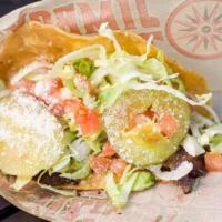 Taco Burger · Chef-griddled stone ground corn tortilla, cheese, pickles, lettuce, diced tomatoes, mustard,...