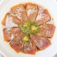 Pepper Fin · Hot. Thinly sliced white tuna served with jalapeños and a ponzu based dressing.