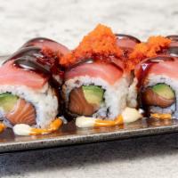Cherry Blossom · Salmon and avocado inside. Topped with tuna, masago, and special sauces.