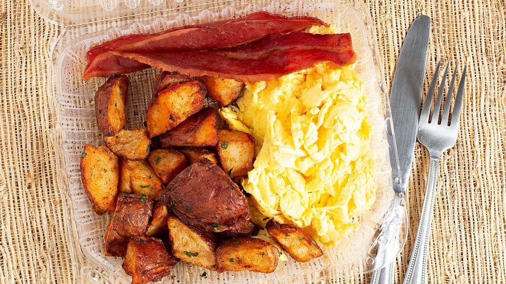 American Breakfast · Two eggs any style, house potatoes, turkey bacon or real bacon, and fresh fruit.
