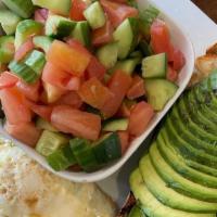 Israeli Breakfast · Two poached eggs, Israeli salad, two toasts of your choice, with one fresh avocado.