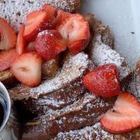 Junior French Toast · Two halves of brioche French toast with fresh berries and powdered sugar. Served with one sl...