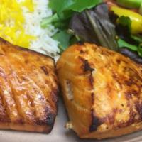 Salmon Kebab · Seasoned fresh grilled wild salmon fillet. Served with hummus, garlic sauce, and 2 sides.