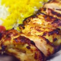 Chicken Kebab · Juicy marinated chicken breast. Served with hummus, garlic sauce, and choice of 2 sides.
