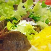Gyro Plate · Combination of seasoned ground lamb and beef broiled on a vertical rotisserie. Served with h...
