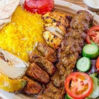 Mixed Kebab · Combination of shish, beef, and chicken kebab. Served with hummus, garlic sauce, and choice ...