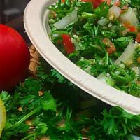 Tabouli Salad · Chopped parsley, diced tomatoes, cracked wheat, green onions, herbs, lemon juice, and extra ...