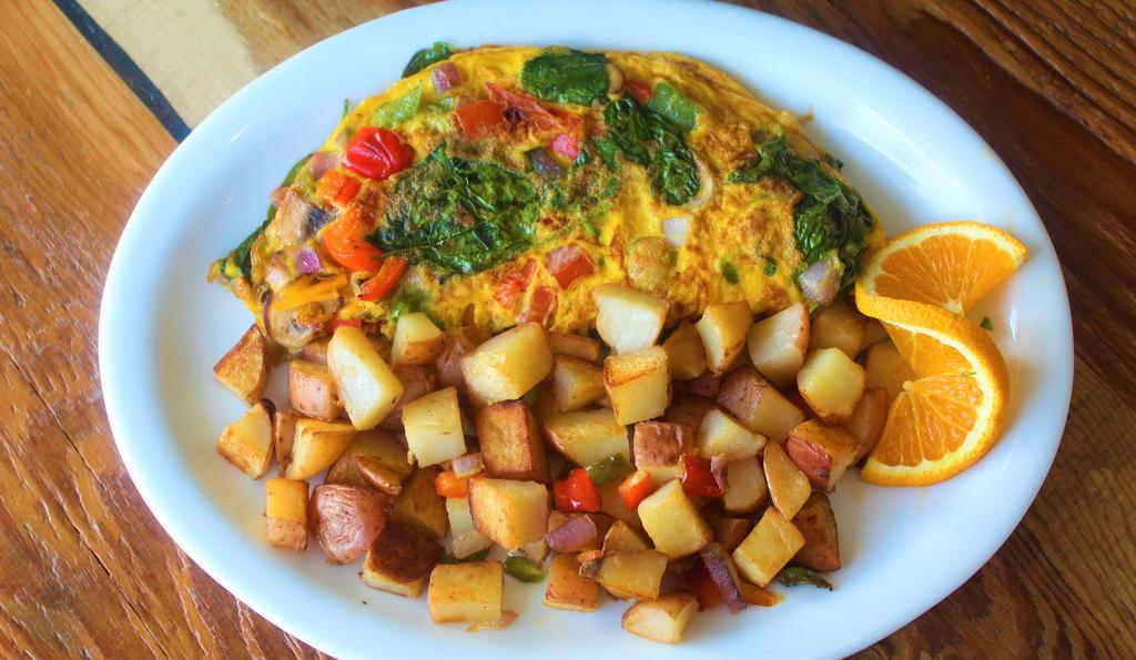 House Omelet · Free Range Eggs, spinach, mushrooms, bell pepper, tomatoes, onions, plant based cheese. Served with country potatoes and your choice of two 21 grain toast or one vegan pancake.

Add: 1 gluten-free pancake+$2.00 – Add: Fruit Salad+$2.50 – Add: Avocado+$1.00 – Add: Pasturebird (Always outside) grilled chicken+$3.50