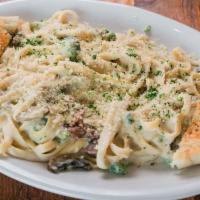 Cashew Alfredo Pasta (Vegan) · Fettuccine pasta with cashew Alfredo sauce, mushrooms and broccoli and plant-base Parmesan c...