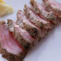 Seared Black Pepper Tuna Sashimi · 6pc ahi tuna with a seared pepper crust, drizzled in ponzu sauce