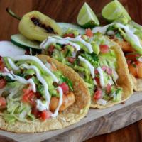 Shrimp Tacos · Handmade corn tortilla, Breaded Shrimp, pico de gallo, lettuce, guacamole, and a creamy hous...