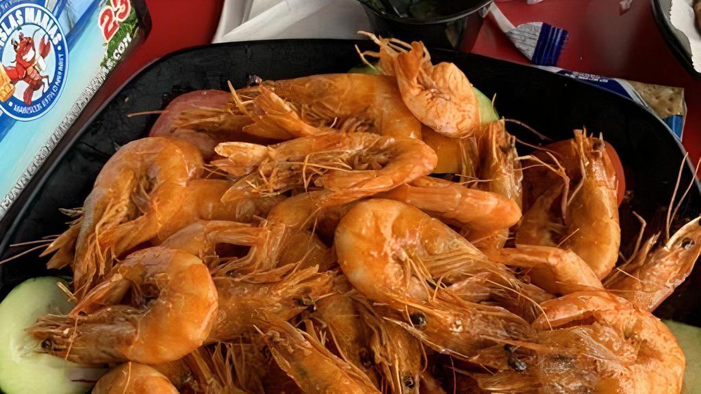 Camarones A La Cucaracha · Head on shrimp cooked in our spicy sauce.