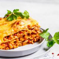 Meat Lasagna · Juicy beef, tomatoes, and mozzarella over layers of beautifully cooked tender pasta with fre...