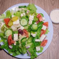 Greek Salad · Lettuce, tomato, kalamata olives, feta cheese, and red onion.
