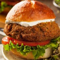 Falafel Mediterranean Burger · Fresh crispy falafel with tomatoes, onions, cabbage, mayonnaise and cheese.