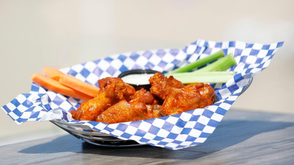 Twice-Cooked Buffalo Wings · Chicken wings baked and then fried to perfection and tossed in buffalo sauce, served with celery, carrots, and bleu cheese dressing.