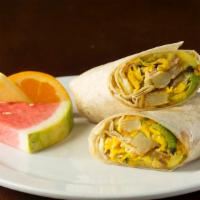 Veggie Breakfast Burrito · Eggs, veggie sausage patties, house potatoes, avocado. Served with Our Signature Homemade Sa...