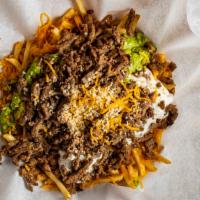 Carne Asada Fries · Steak, fries, with guacamole, sour cream, and cheese.