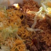 Beef Taco & Enchilada · Includes rice and beans.
