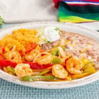 Shrimp Fajita · Cooked with Mi Casa homemade sauce, vegetables, served with rice, beans and sour cream.