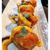 Spicy Tuna Crispy Rice · Spicy. Deep fried rice patty topped with spicy tuna, spicy mayo, eel sauce & cilantro (2 pcs).