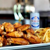 Combo (Family) · 30 wood fried wings up to 3 flavors, 2 large fries or veggie sticks, and 3 dips (feeds 3-4).