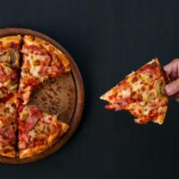 Zcarnivore Pizza · Housemade marinara pizza garnished with mozzarella, pepperoni, oregano, smoked ham and bacon.