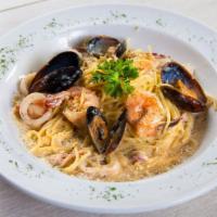 Seafood Cream Pasta · Favorite. Creamy parmesan pasta sauce with sautéed garlic and onions, shrimp, mussel and cal...