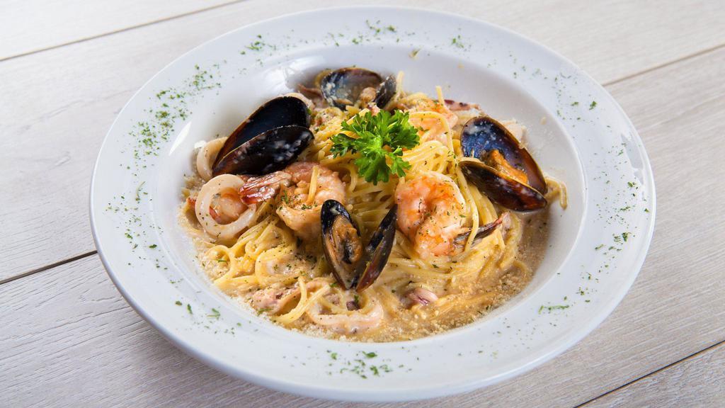 Seafood Cream Pasta · Favorite. Creamy parmesan pasta sauce with sautéed garlic and onions, shrimp, mussel and calamari.