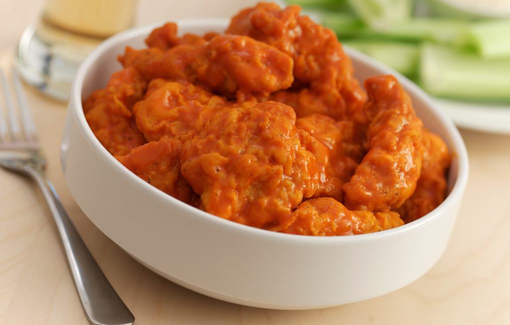 Boneless Wings Fried  · Grab a fork and knife for these hand-breaded wings. Your napkin just might thank you.