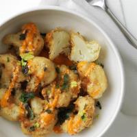 Cauliflower Wings · Hand-breaded cauliflower, fried and drizzled in our signature Roasted Garlic Medium sauce an...